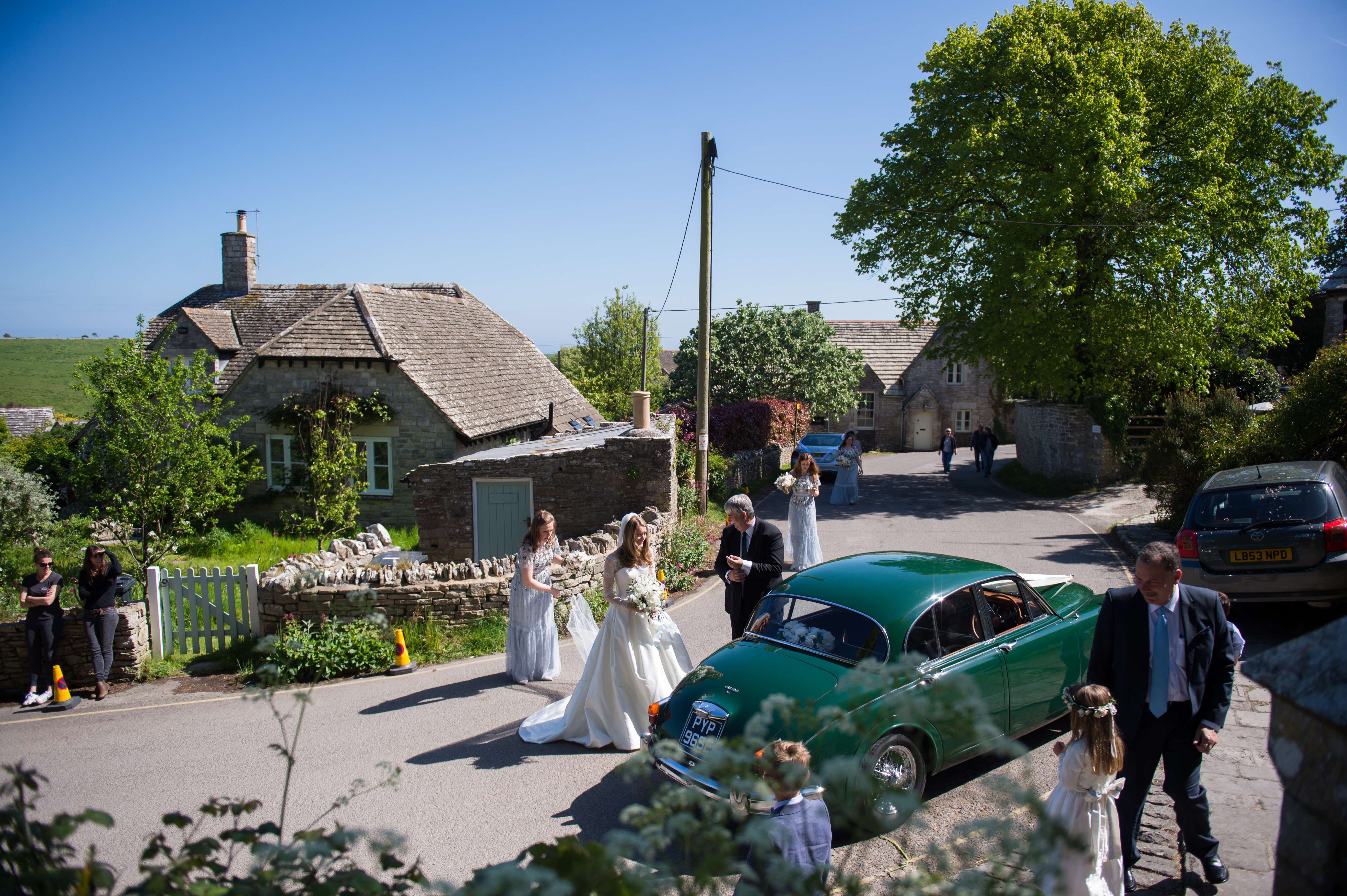 bride arriving at church in dorset for her wedding